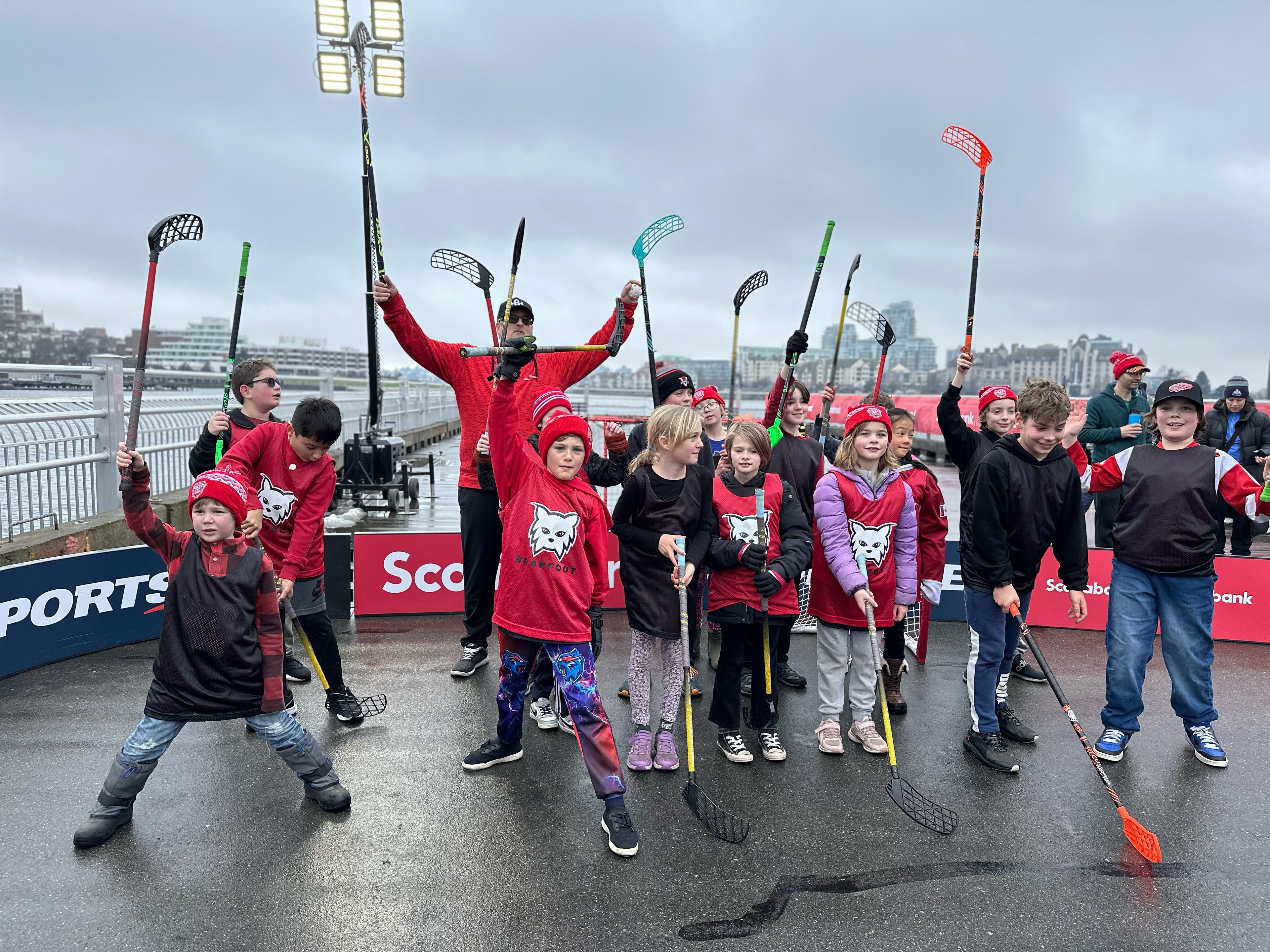 Hockey team cheering with Hockeyball sticks